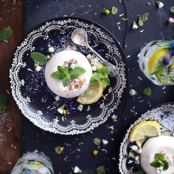 Vegan panna cotta - coconuts, fresh mint and daisies. The picture created for a cook book presenting healthier versions of traditional meals.