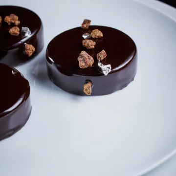 It's almost Christmas and these chocolate tarts set the scene. The really talented Andy Blas, expert patisserie chef from Cafe Royal, London. This was shot for a lovely feature in Seasoned by Chef Magazine. I just love the silkiness of the chocolate edge...but then, I would - the sweet tooth in me had to be restrained when I shot it.<br />
<br />
Photographer: @jodihindsphoto<br />
Magazine: @seasonedbychefs<br />
Chef: Andy Blas