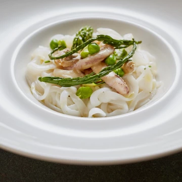 This is from a recent shoot at private members club Homehouse, Portman Square, London. <br />
Recently appointed head chef, Fabio Petrucci, created this stunning Squid Tagliatelle with samphire, asparagus & peas<br />
<br />
Restaurant: @homehouselondon<br />
Chef: Fabio Petrucci<br />
