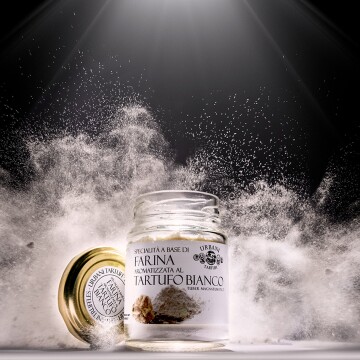 Only one shot and one chance for this dynamic image.  The contrast between the white of the flour and the black background is enhanced by the rim light.