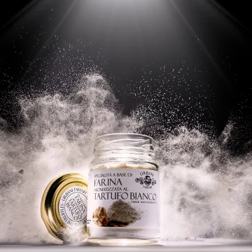 Only one shot and one chance for this dynamic image.  The contrast between the white of the flour and the black background is enhanced by the rim light.
