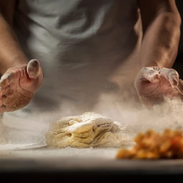 Manual pastry is still alive in the made in Italy tradition. In this shot, the pastry chef prepares a cake with mother yeast.<br />
Shot with continuous led light and Nikon D810