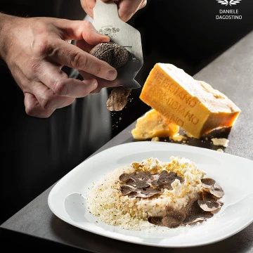 Risotto is an Italian tradition that pairs wonderfully with truffles and popcorns.  recipe by chef Michele Casadei Massari.<br />
Shot by Nikon D810 and Nikkor 24-70 f2.8. 2 suorce of light.
