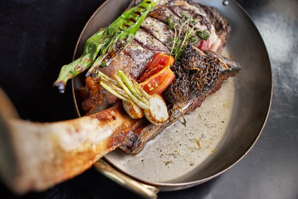 Ribeye steak at Steak and Whiskey for Time Out Los Angeles.  Shot with diffused window light and a Canon EF 40mm f/2.8 STM lens. 1/60 sec; f/4.0, ISO 640.