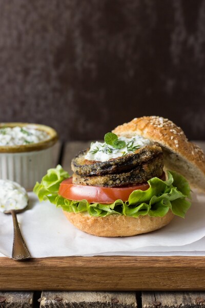 This is a photo of vegetarian burger made with aubergine slices fried in a walnut crust. I served it with vegies and my beloved tzatziki.