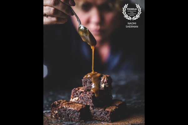 Drizzling dairy-free Dulce de Leche over a pile of my famous Epic Brownies.<br />
Taken in my studio using natural light, my 90mm macro lens and a remote trigger