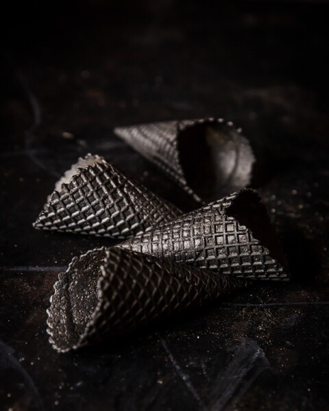These black waffle cones were shot in my studio, using natural lighting.
I particularly liked the play of light and shadow across the texture of the cones