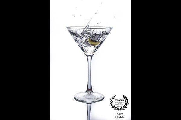 Photographing a martini for a local restaurant, I decided to spice up the classic iconic martini glass by dropping an olive in it and recording the splash.
