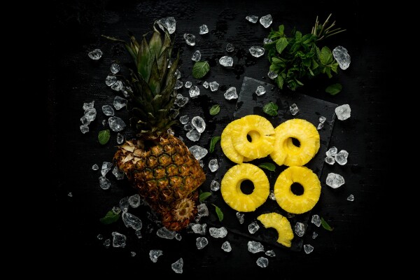 Pineapple and Mint 
A golden combination!
Camera: Canon 5D mark iii
Lens: 50 mm 
Settings: ISO 1000, 1/80 sec at ƒ/10, daylight