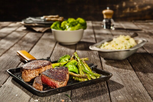 I love the warmth of this shot, which reminds me of so many happy memories of barbecues with friends. Capturing the medium-rare cross-section of the meat was the biggest challenge for this shot, though bouncing the back-light into a small mirror and back into the cross-section area gave it the clarity we needed.
This succulent cut was shot in-studio, using no natural light - just Bowens 500W monoblocks + studio tricks! The aim was to recreate a distinctly Australian outdoor quality of light, which was done by firing my key light through a custom-made flag on which I'd stenciled-out the silhouette of a gumtree canopy. It was a lot of work, but the client took some great images to market themselves with to Europe in the months following the shoot, where they won the accolade of 'The best beef in the world'!

Food Stylist: Pete May.
