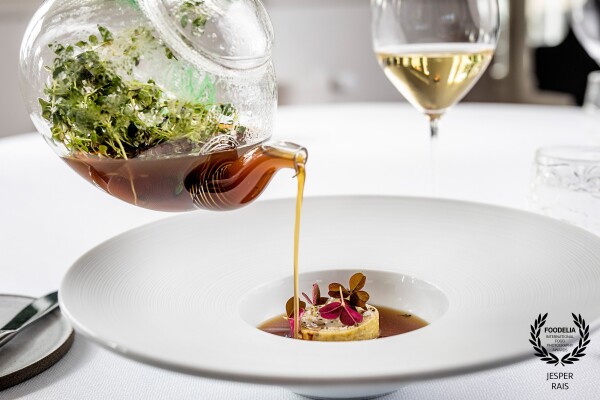 Consommé Celestine - Duck liver pancake with picky gel, red sorrel and a wild game consommé by chef Steffen Villadsen from Molskroen in Denmark.