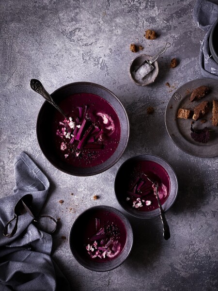 Beet soup served with sour cream and feta cheese.