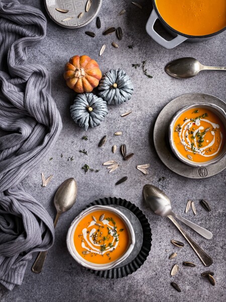 Pumpkin soup with roasted sunflower seeds. The image captured with a natural light.