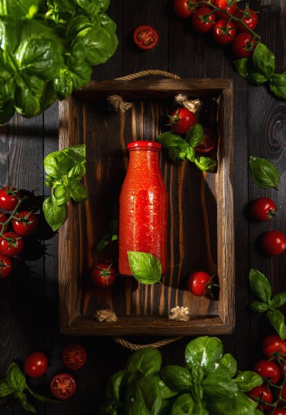 Bottle of tomato juice.  Advertising photo shoot of the local Ukrainian garden family farming.