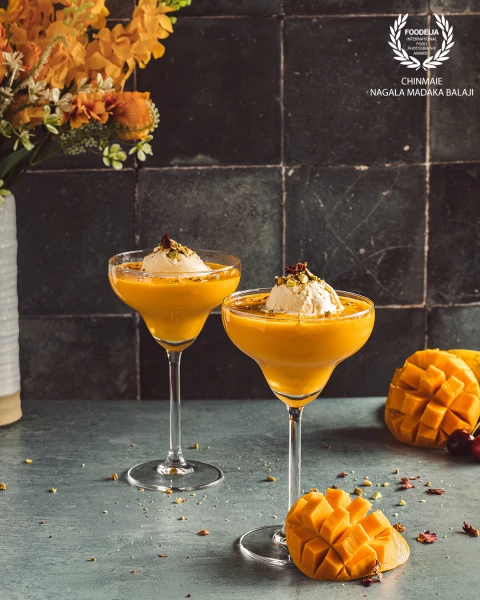 Mango Mastani - A summer drink with mango milkshake topped with ice cream and lots of nuts.