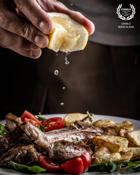 A lovely meat plate with lemon shooting for social network