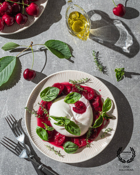 Summer elegance on a plate – creamy burrata paired with sweet cherries, fresh basil, and a drizzle o...