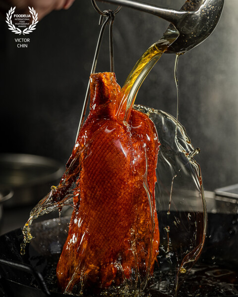 Created for @nuerhongrestaurant, this shot captures the exact moment boiling oil is poured over the...