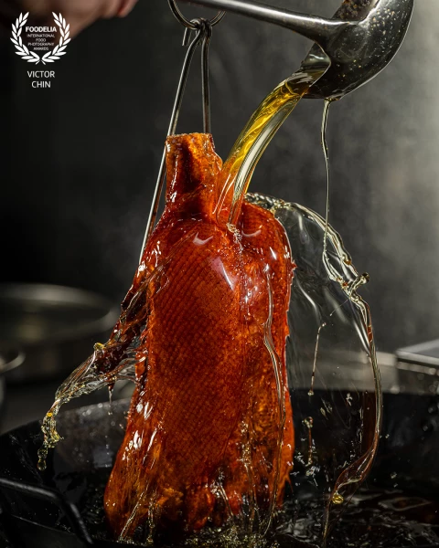 Created for @nuerhongrestaurant, this shot captures the exact moment boiling oil is poured over the...
