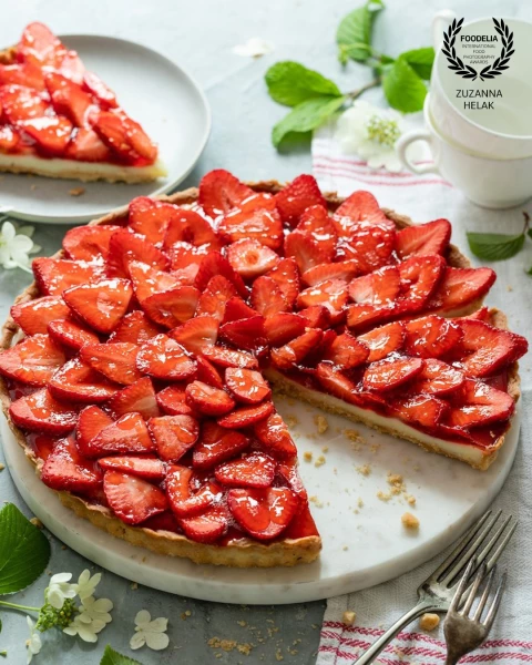 Capturing the essence of a sun-drenched summer afternoon. The bright, luscious red of the strawberri...