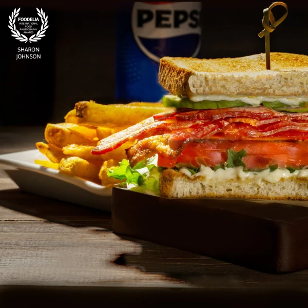 Crispy bacon, fresh lettuce, juicy tomatoes, and perfectly toasted bread—styled with a dinner vibe....