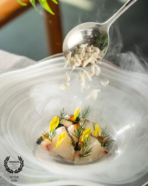 Created for @skillet_kl, this image captures the final plating moment as frozen pomelo falls through...