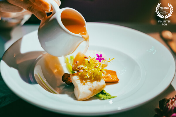 The Pour That Awakens

A hand tilts the vessel—slow, deliberate—summoning a golden rain.
It falls in...