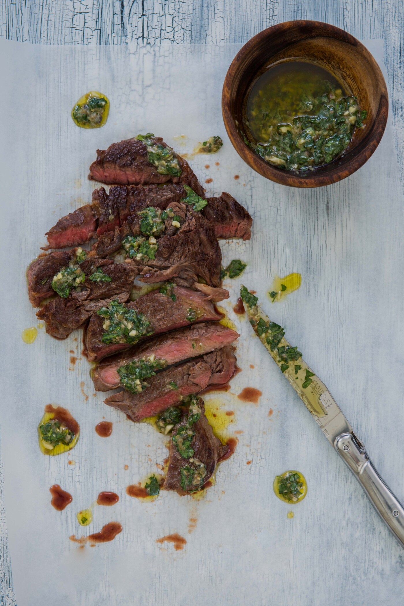 Back home, my favorite restaurant that makes a great steak served with chimichurri on the side. I was missing home the day I shot this, and craving that delicious and perfectly cooked dish and so I tried to replicate it in my kitchen. I shot it the way I like to eat it; slathered in chimichurri and bursting with flavor!