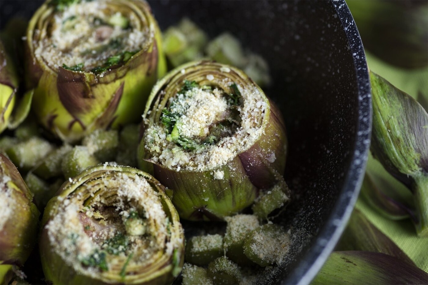 I always find Beauty in Food... I was working on a shooting for the local market producers and I chose those stunning artichokes, arranging them in a very simple recipe with a parsley-garlic and bacon filling and a generous handful of parmesan cheese. I was really struck by the wide range of green hues and by the burgundy shades which I wanted to enhance. PS They were delicious as well!