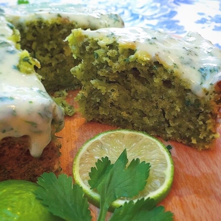 This is a Fresh Coriander and Lime Cake with Coriander and Lime Cream Cheese Frosting. I developed this recipe to showcase just how versatile fresh herbs can be and I wanted to move away from the traditional savoury dish setting.  The finished result was colourful and deliciously fragrant cake with the unique flavour of fresh coriander, balanced out beautifully by the natural citrus sweetness of the lime and complemented by the creamy frosting. 