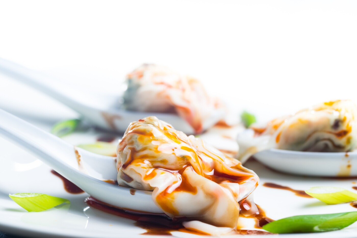 Chaozhou means Wonton in Szechuanese dialect (the area of Southwest China). Unlike serving with soup commonly, the traditional Szechuan way is to dress with sesame oil, soy sauce, and red chilli oil. Therefore, the full name of this famous Szhcuanese cuisine is Chaozhou with Red Chilli Oil.