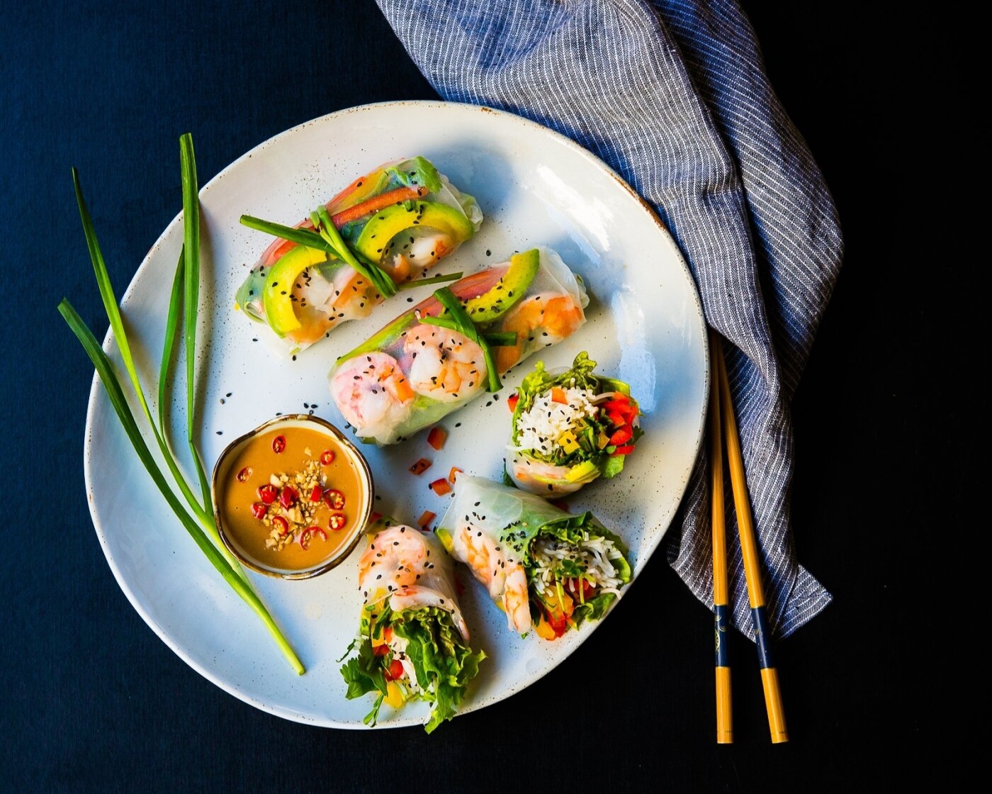 Vietnamese-influenced shrimp avocado spring rolls served with a peanut ginger dipping sauce.