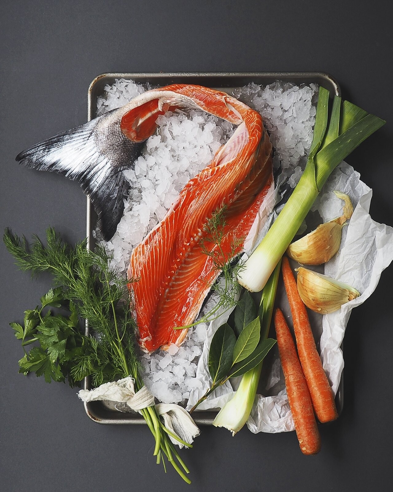 This fresh wild Alaskan salmon carcass came from a local fishmonger who generously gave it away to me for almost nothing.  I styled and shot this photo to tell the story of making a fish stock with this eye catching organic beauty from nature.<br />
                        