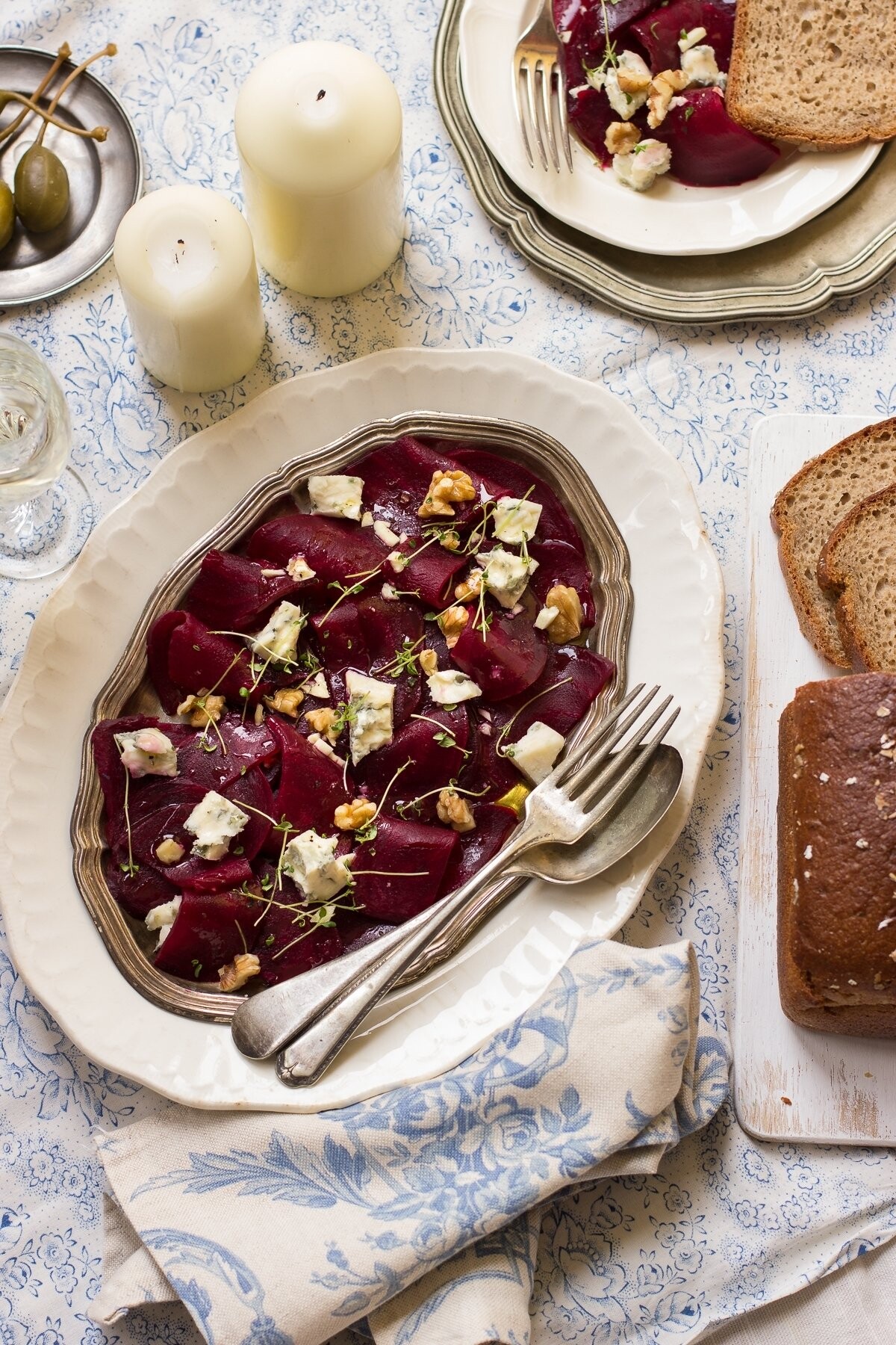 This a photo of insalata di barbabietole, an Italian salad made of thin beetroot slices, gorgonzola and walnuts served with garlic honey dressing. I learned this recipe on Italian food workshop.