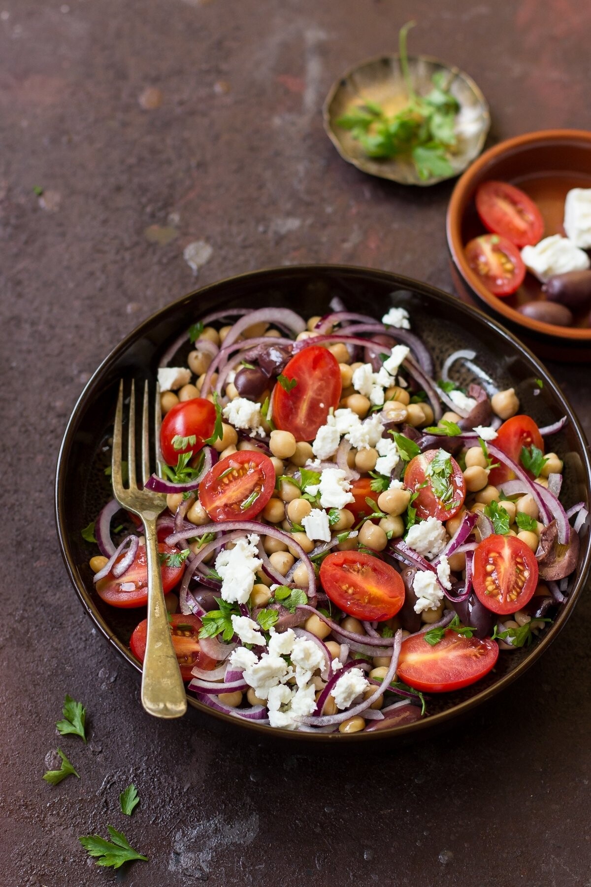 A Turkish salad made with chickpeas, red onion, olives, cherry tomatoes, feta and parsley.