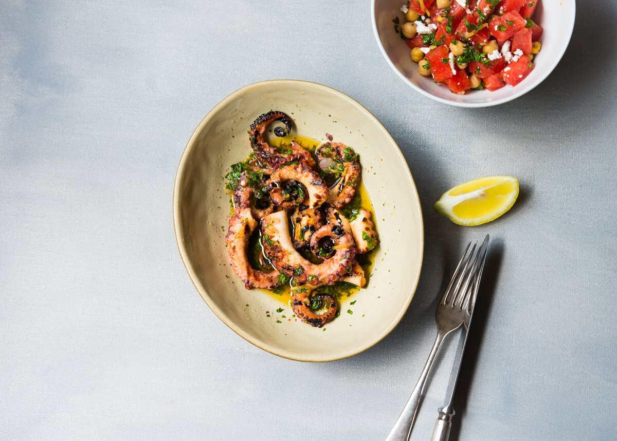 Charred tender pieces of octopus bathed in a lemon herbed garlic aioli is a Mediterranean inspired dish which I adore very much.  It is served with a side of watermelon, chickpea and feta cheese salad.