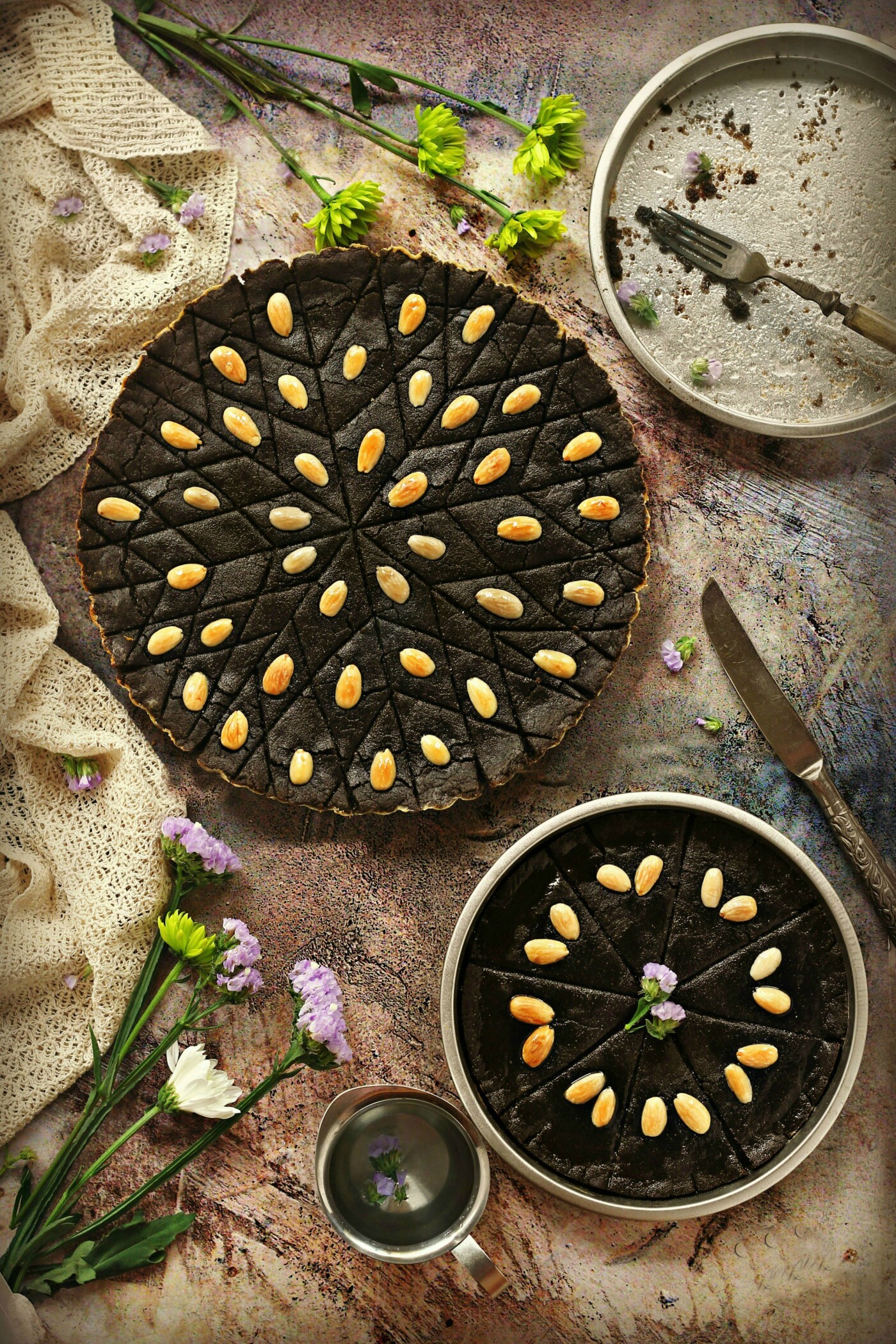  Qizha Pie is a traditional Palestinian sweet dish that consists of black cumin, or as we call it here in the middle east :qizha paste or Nigella seeds.It has many health benefits. Rich of unsaturated important fatty acids, antioxidant, powerful immune booster,  As a result of all this, black seeds are used in different cuisines especially the eastern ones as seasoning spices for salads, and bread… and here it used to make a healthy sweet pie! 