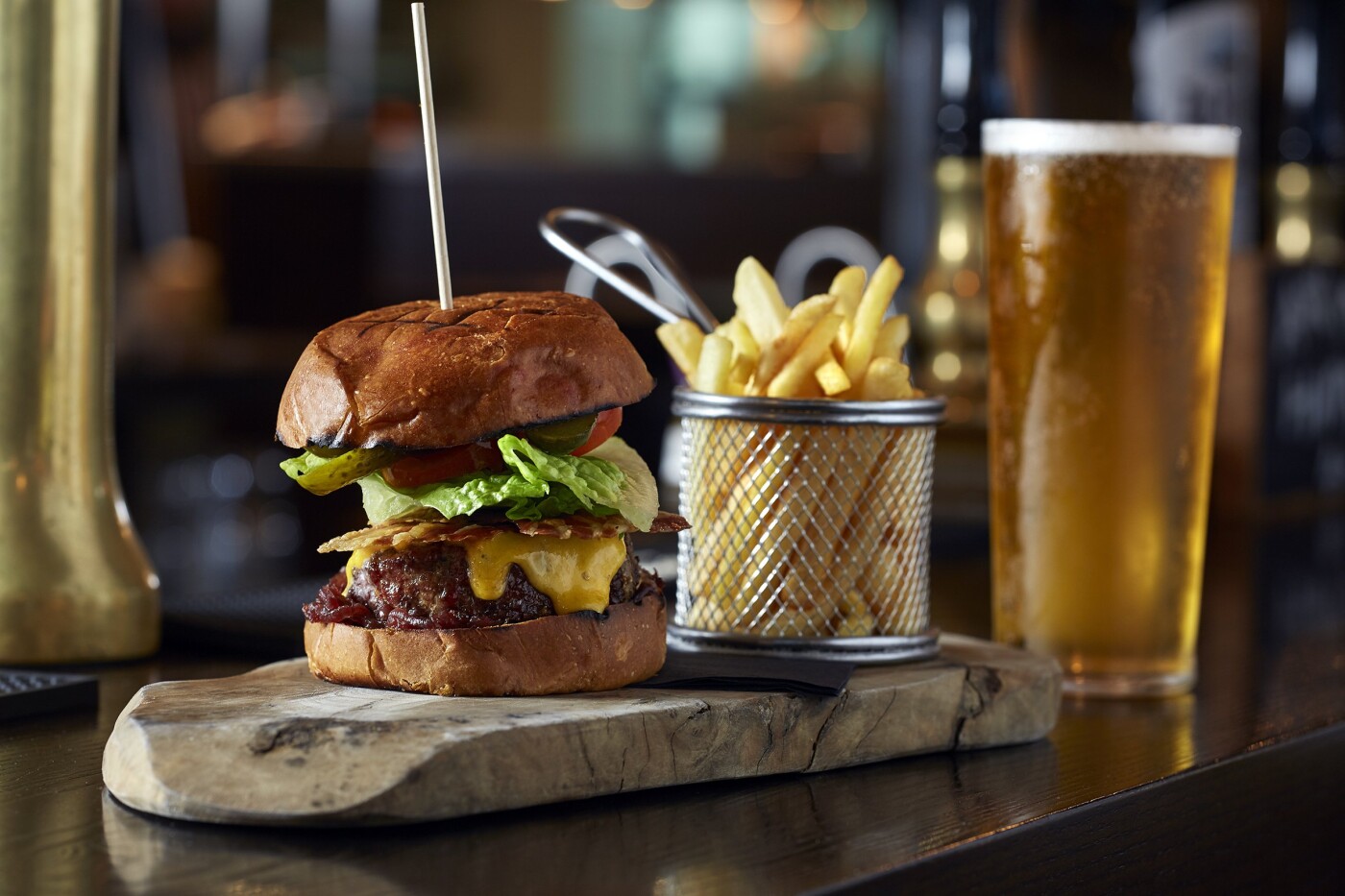 This juicy cheese and bacon burger served with crispy fries and a refreshing lager was shot for The Captain Cook Pub in Fulham, London. They taste as good as they look!