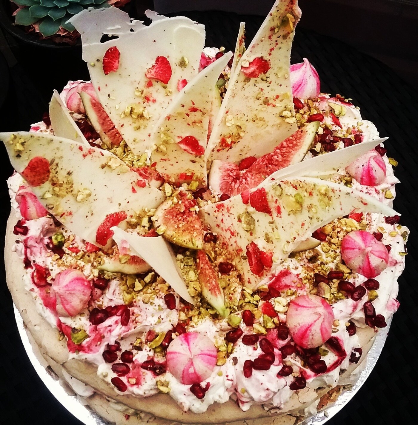 My Persian Inspired Pavlova....This is one of my favourite desserts!! I created this for a client of mine, she asked for a pavlova but wanted something different. So i came up with this beautiful recipe of rosewater, pistachios, cream, figs, fresh raspberries, freeze dried raspberries, pomegranate and white chocolate shards. Its such a pretty Pavlova I just love it!