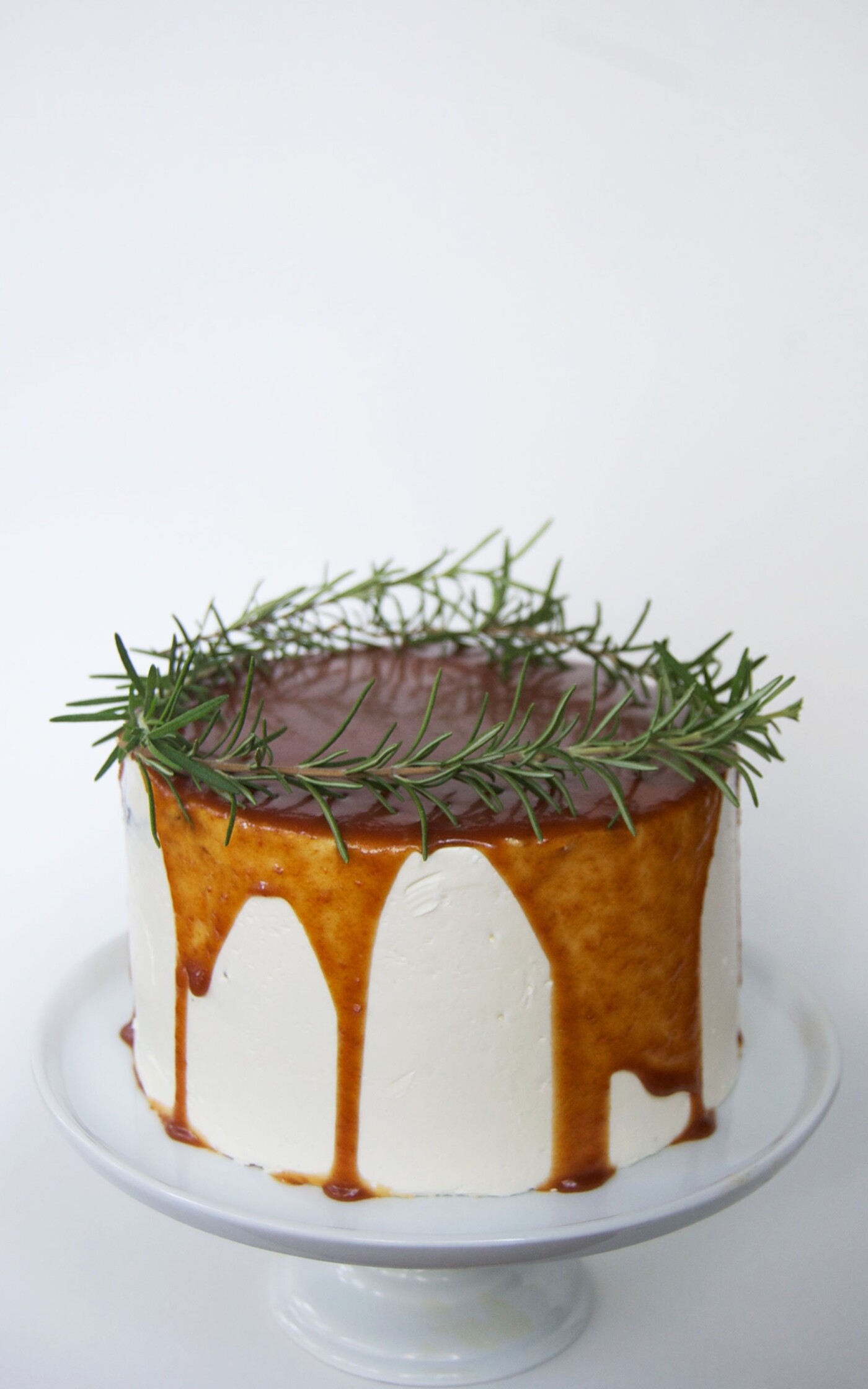 In the language of flowers, rosemary is emblematic of remembrance, so this caramel cake is topped with a halo of rosemary as a way to remember and honor my grandmother. Since her name was Rose — another flower — I feel that it carries extra meaning. She was an outstanding baker, and specialized in jumbo caramel rolls, so I know she would have liked this cake. 