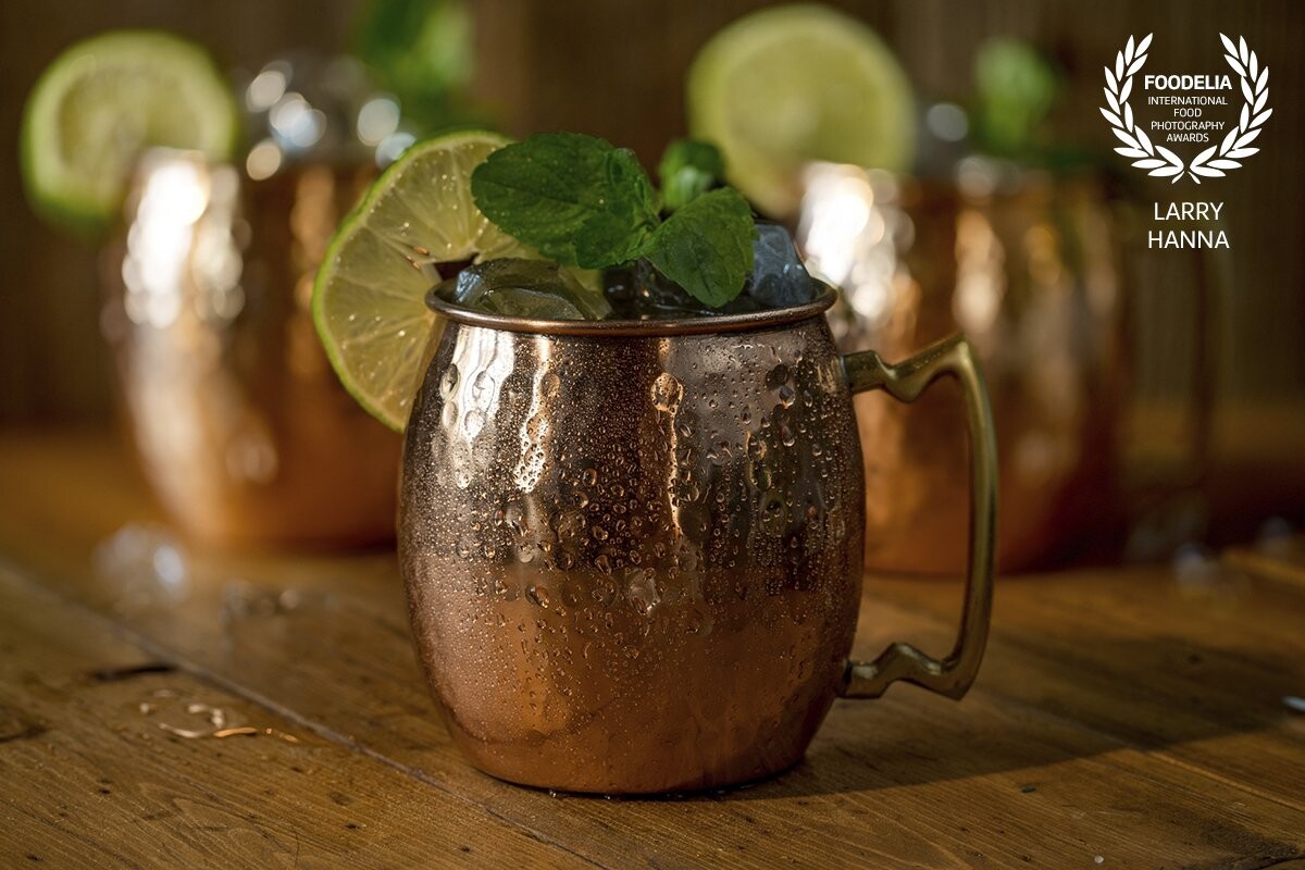 The Moscow Mule is a very common drink around my home.  I love the look of the copper mug and on a slow day I decided to photograph one just to do it.  Most of my photography is for restaurants, so it is always fun just to do something on my own.  I created this image by a window in my home using only window light.