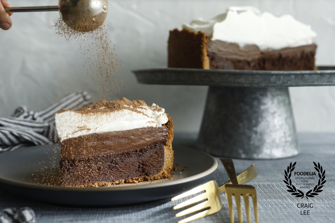 Dusting of cocoa powder on Mississippi Mud Pie. Recipe photographed for the New York Times Cooking section @nytfood. It's a nice rich dessert for the chocolate lover. Styled by @the_bojon_gourmet and @snixykitchen.