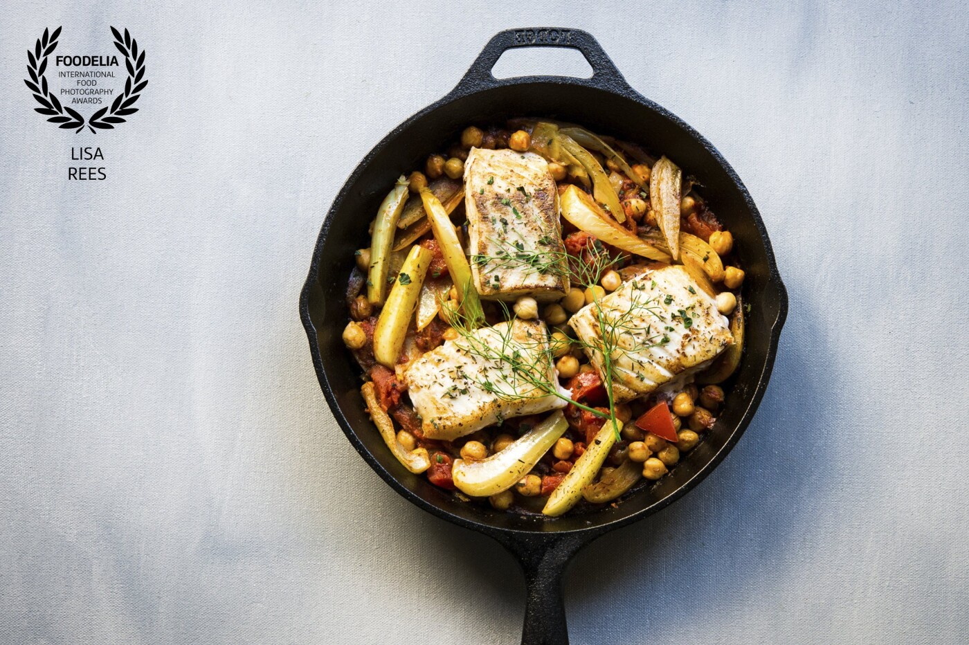 This one-skillet Mediterranean dish showcases some of the wonderful ingredients that I love from the region:  Za'atar spice rubbed halibut fillets pan seared amongst fennel bulb wedges, tomatoes, chickpeas, oregano and a dash of Moschofilero (Greek white wine).