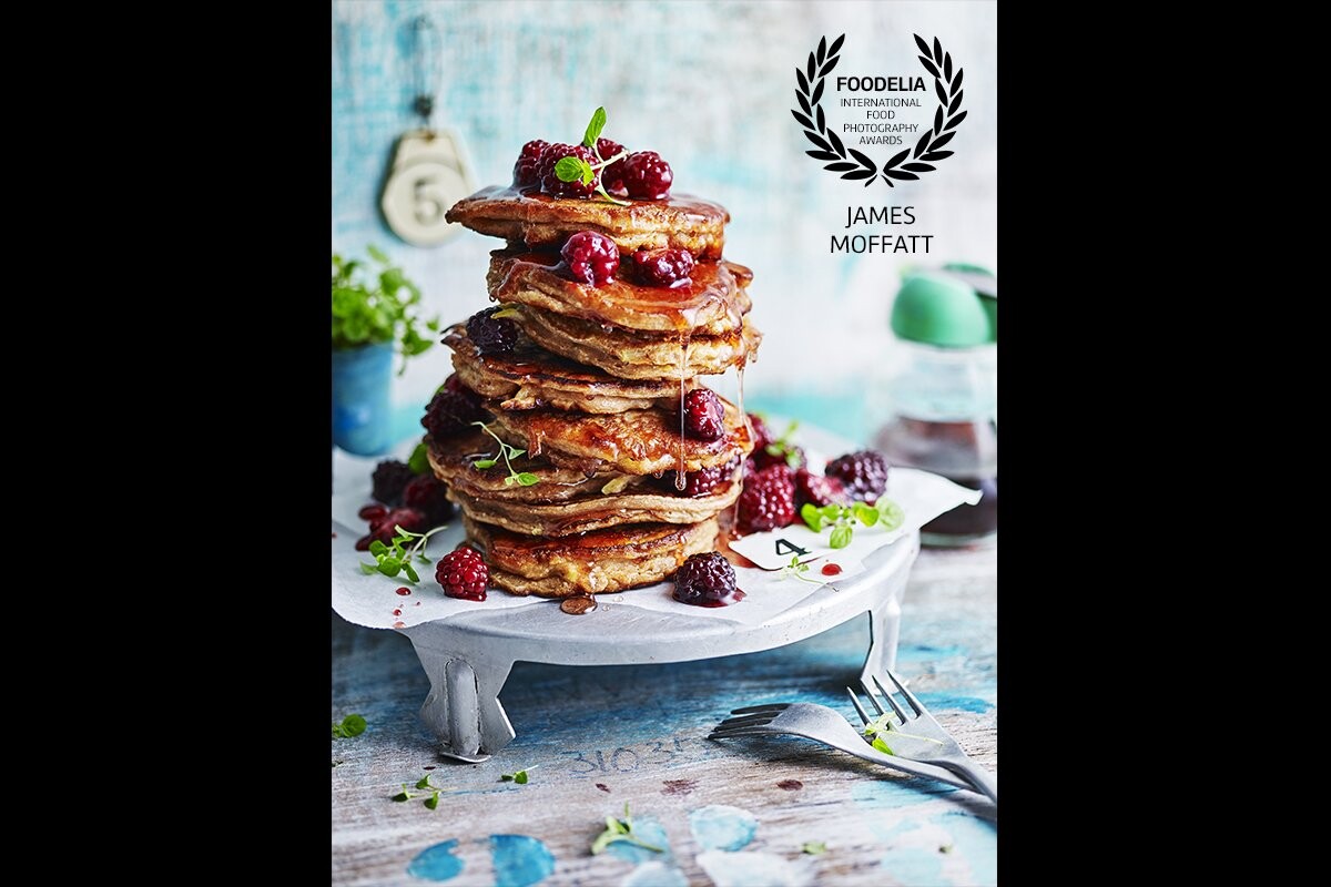 This image of  'Apple Pie Pancakes with Blackberry Compote' was taken for 'Eat Clean with Superfoods' part of  'The Australian Women's Weekly' Cookbook range, this book was released late 2016. The image had to ooze indulgence, yum factor as well has been bright, colourful to appeal to the healthy reader of this title. It was a great project to be involved in stylist Olivia Blackmore. <br />
