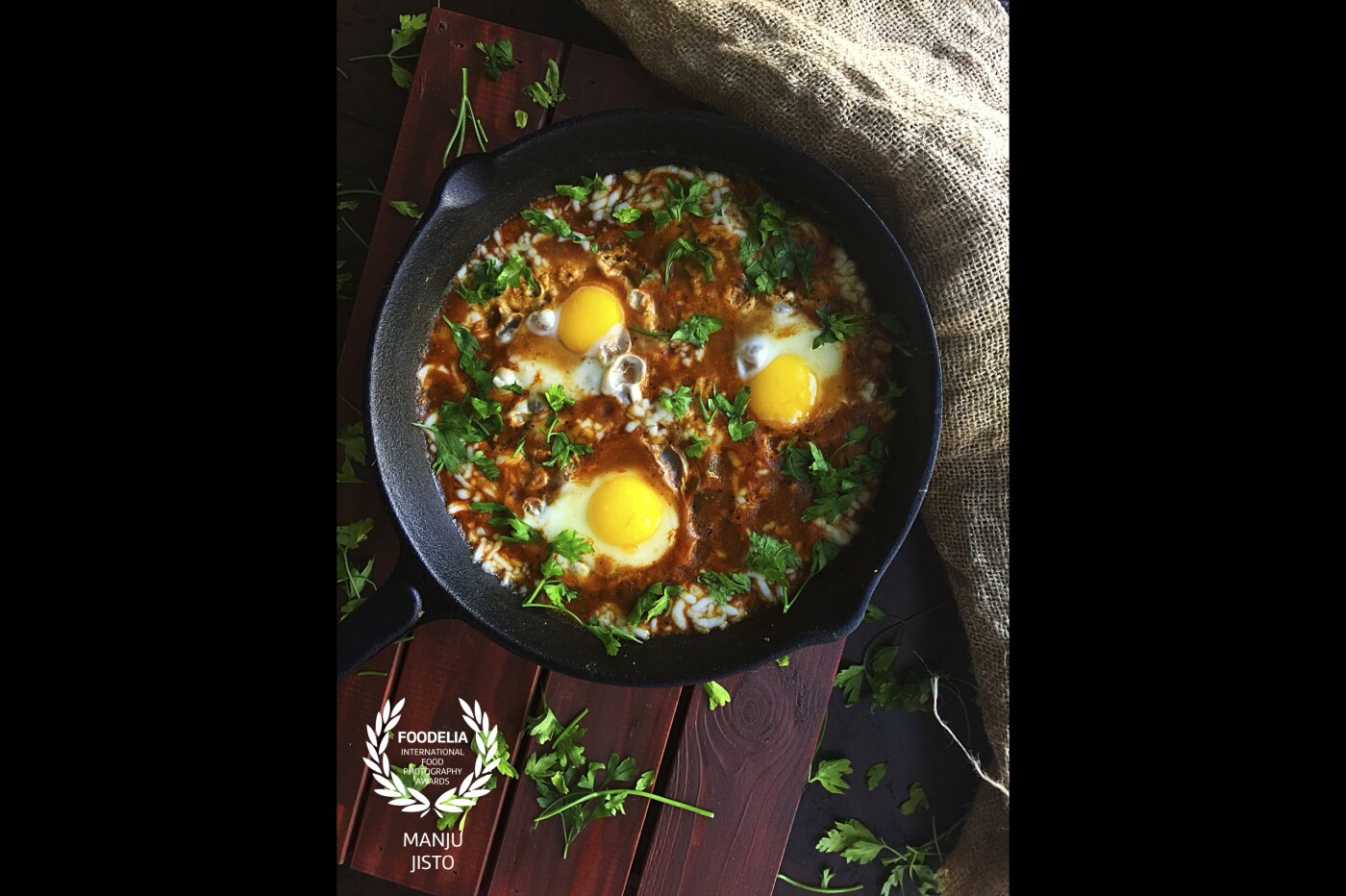 SHAKSHOUKA: It is perfect breakfast dish. Ingredients I added for this dish are tomatoes, onion, green bell pepper, cumin powder, kashmiri chilly powder, black pepper powder, garlic, dry oregano, dry basil, fresh parsley, olive oil, and eggs.  