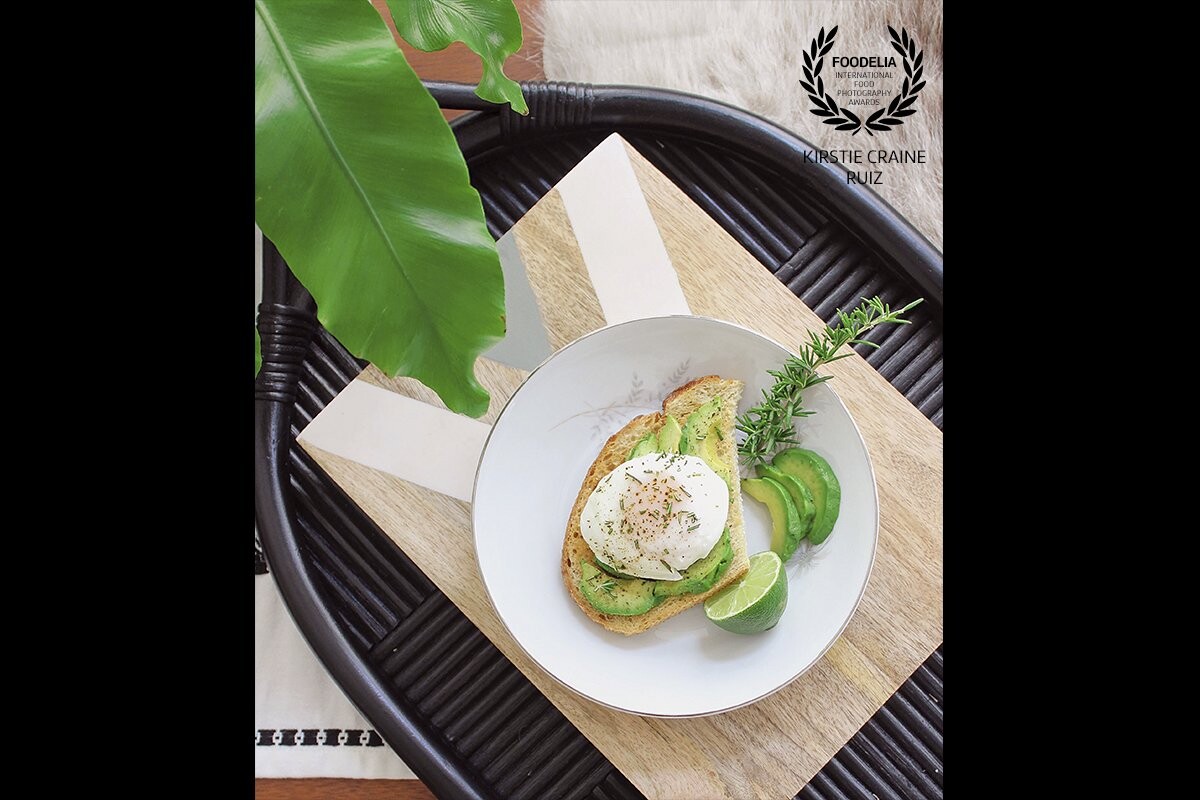Rosemary Avocado Toast:  A Variation on a Trend<br />
Avocado and poached-egg toast with chopped rosemary and lime, styled and photographed for a recipe on my blog at thecrainesnest.com<br />
Photographer, Food Styler, and Recipe Creator:  Kirstie Craine Ruiz <br />
<br />
