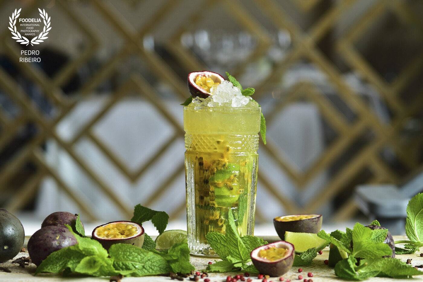 This is the genius of the the restaurant Olivier Avenida In Lisbon. It's a PASSIONFRUIT COLLINS. Fill a highball glass with crushed ice. Add Absolut Vodka, lemon juice and passion fruit puré. Top up with soda water. Garnish with peppermint  and passion fruit.<br />
All part of their cocktail list