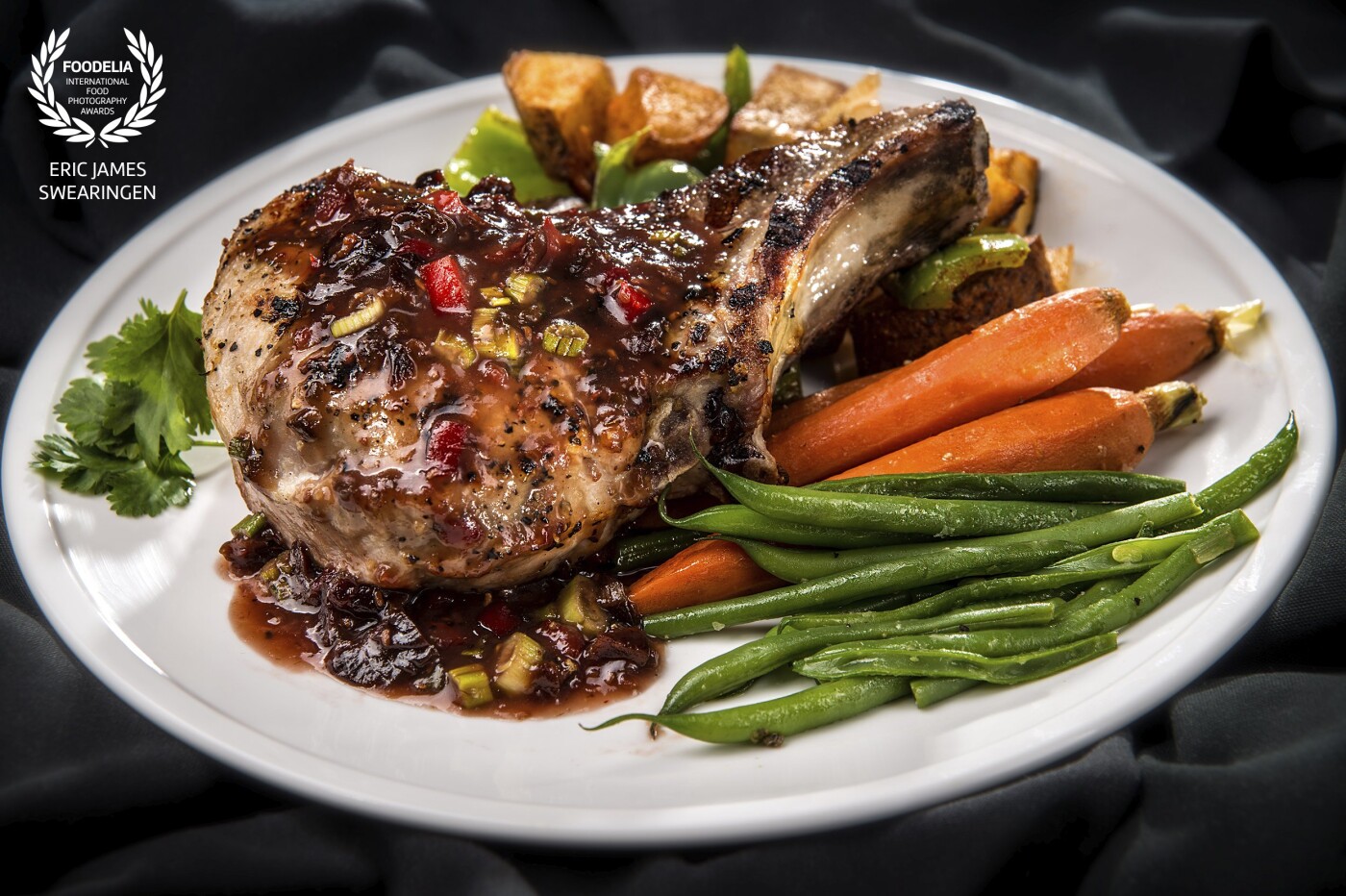 The Stuffed Pork Chop; a signature dish from the world famous K.C. Steakhouse in Bakersfield CA shot for Bakersfield Magazine "What's Cook'n" editorial page. <br />
©2017 Eric James Swearingen <br />
http://www.Food.ArtofEricJames.com  