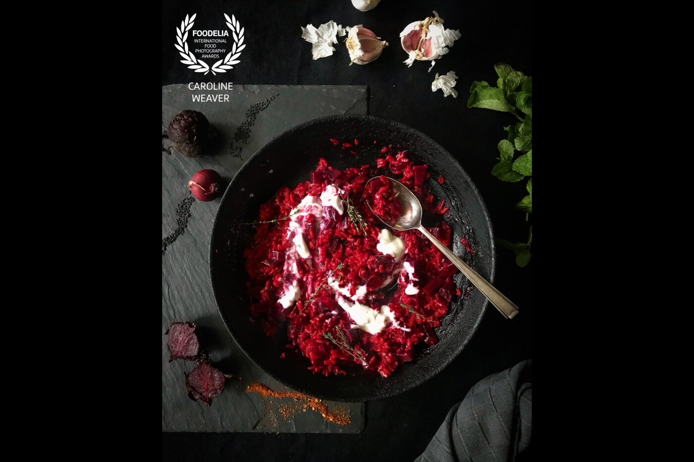 Capturing the last of the season’s beetroot in a vibrant, mouthwatering risotto, in stark relief against a textured black slate background. With just a sprinkling of nigella seeds, this really is a dish for all seasons.