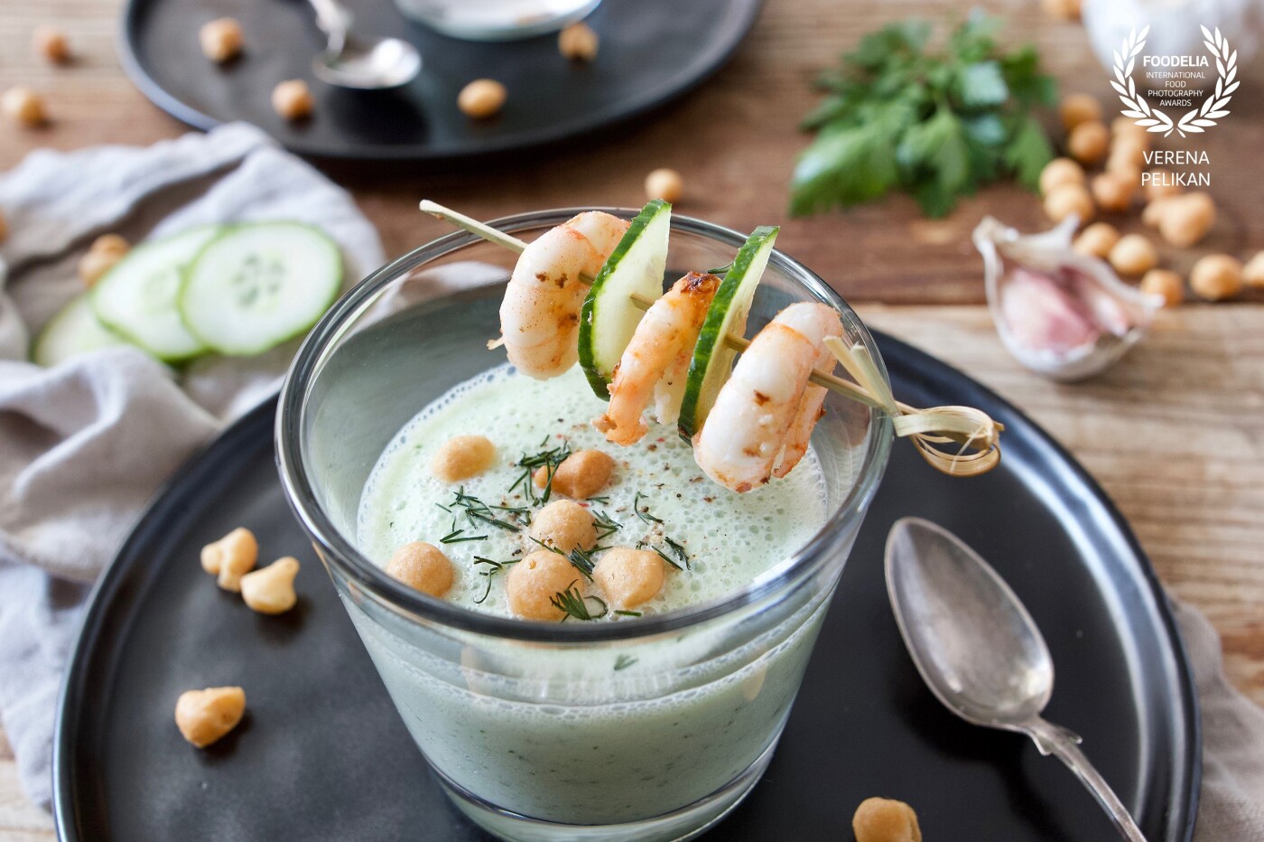 Chilled cucumber soup with buttermilk and yoghurt served with fried shrimps - a light and refreshing soup.<br />
Recipe can be found on my website: https://www.sweetsandlifestyle.com/rezept/kalte-gurkensuppe-mit-backerbsen/